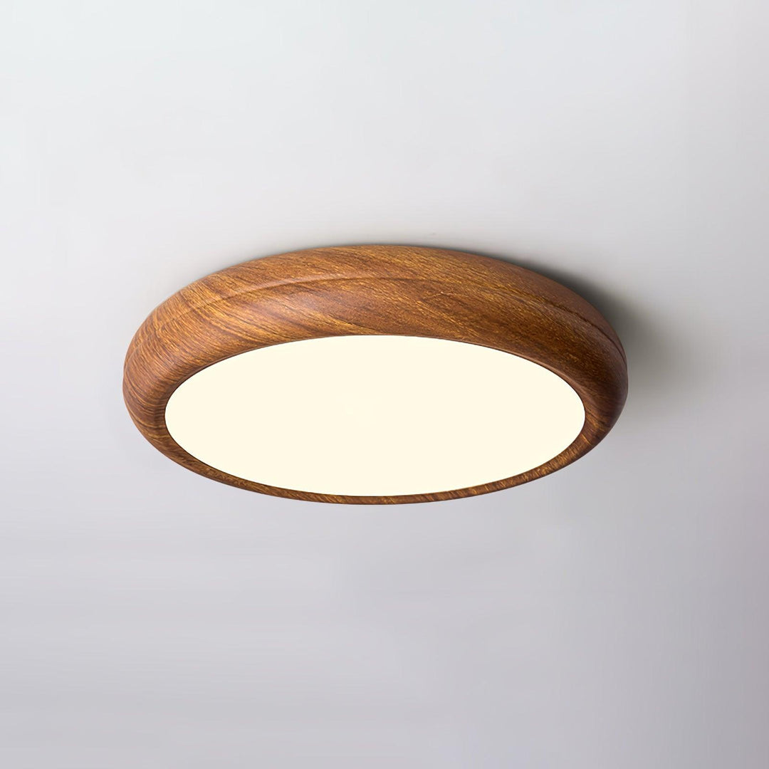 Wood grain modern round LED ceiling light, flush mount, provides diffused light.