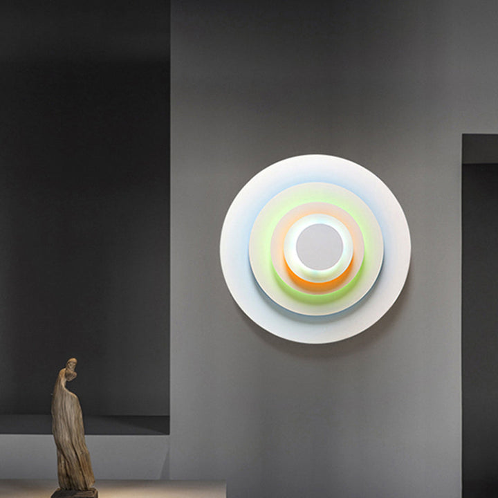 Modern round LED wall light, versatile for various indoor decor styles and illumination.