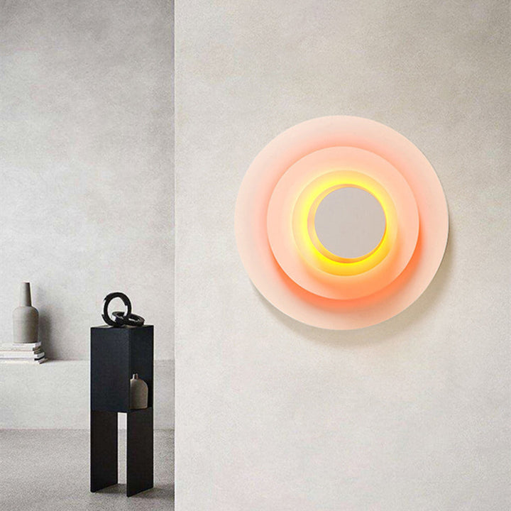 Round LED wall lamp, modern design for indoor home lighting and ambient decor.