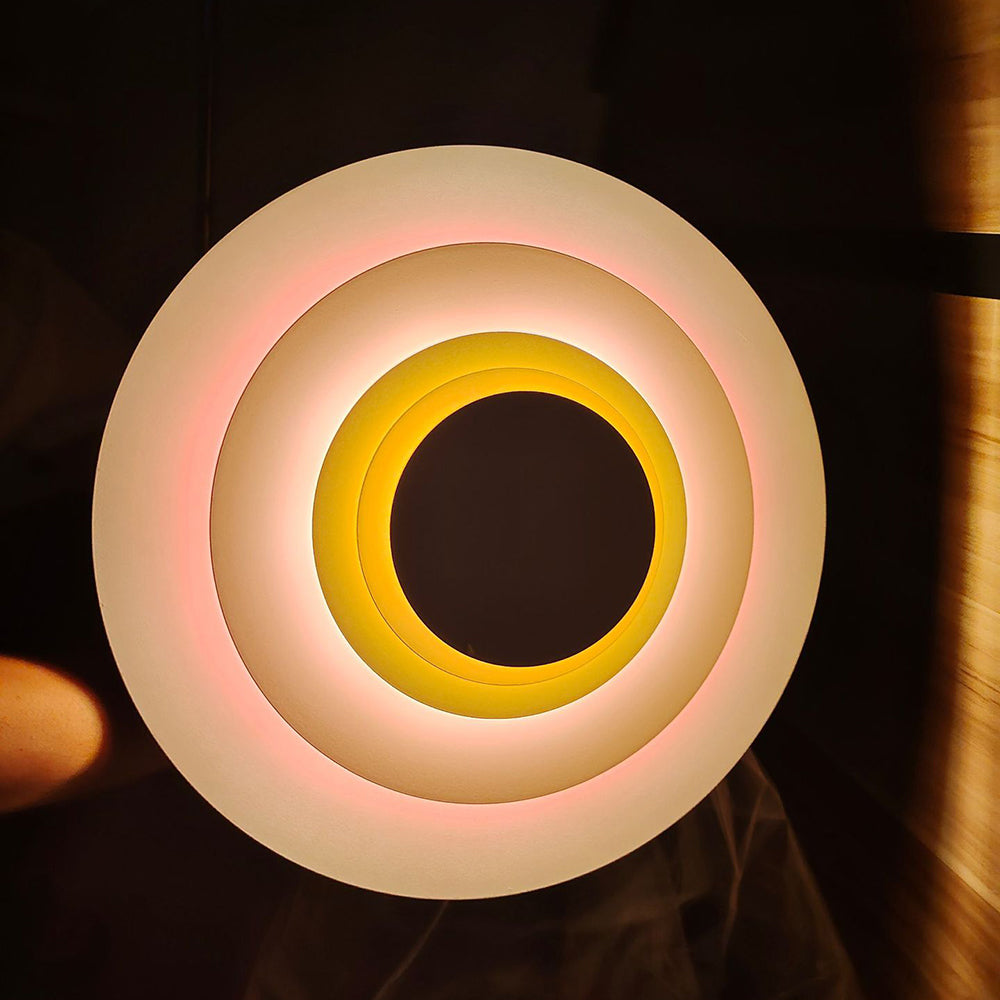Stylish round LED wall light, perfect for modern living room & bedroom decor.