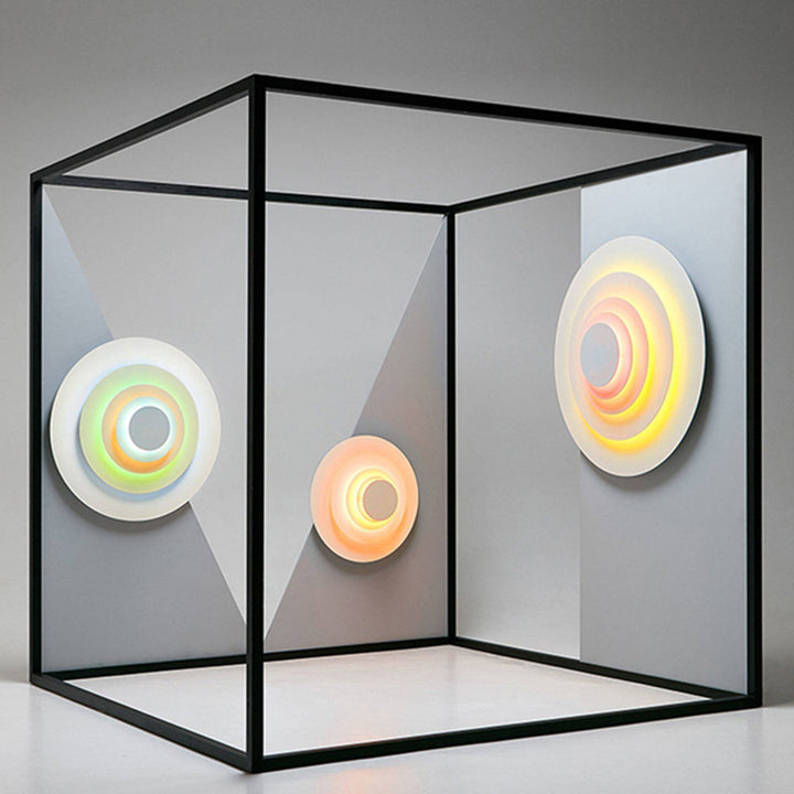 Contemporary round LED wall light for indoor decorative lighting and home aesthetics.