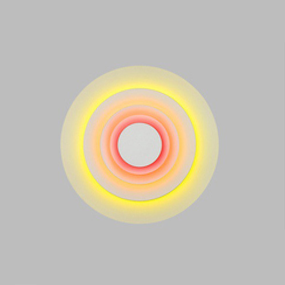 Pink modern round LED indoor wall light, stylish & vibrant for bedrooms and living areas.