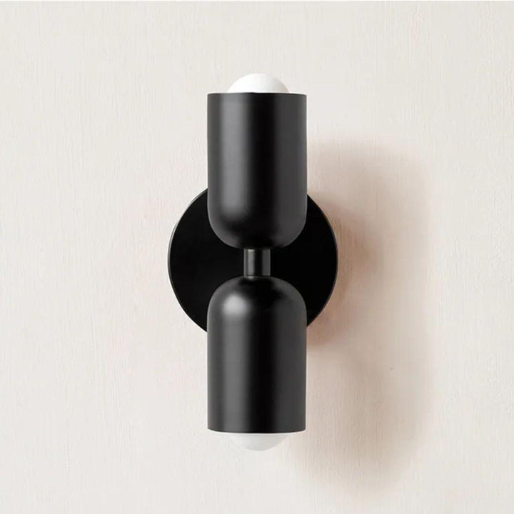Contemporary Scandinavian wall lamp, creating a warm indoor atmosphere.