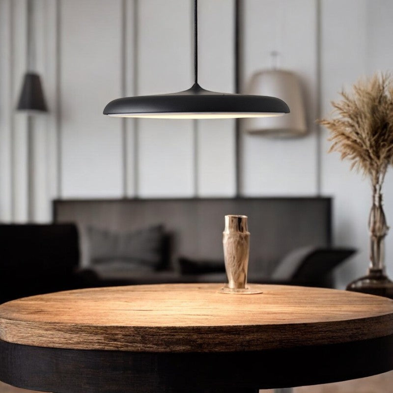 Sleek white LED pendant light, contemporary design for stylish interiors.