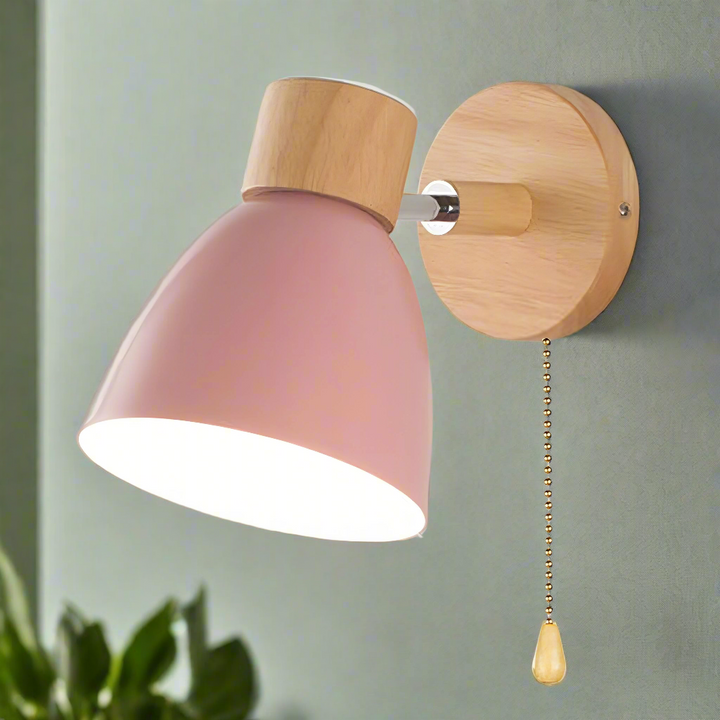 Simple modern Scandinavian wall lamp with a pull switch, offering soft ambient light for a cozy bedroom.