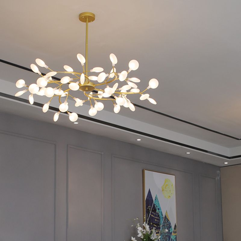 Sculptural LED gold branch chandelier, modern home lighting, sophisticated interior design statement piece.