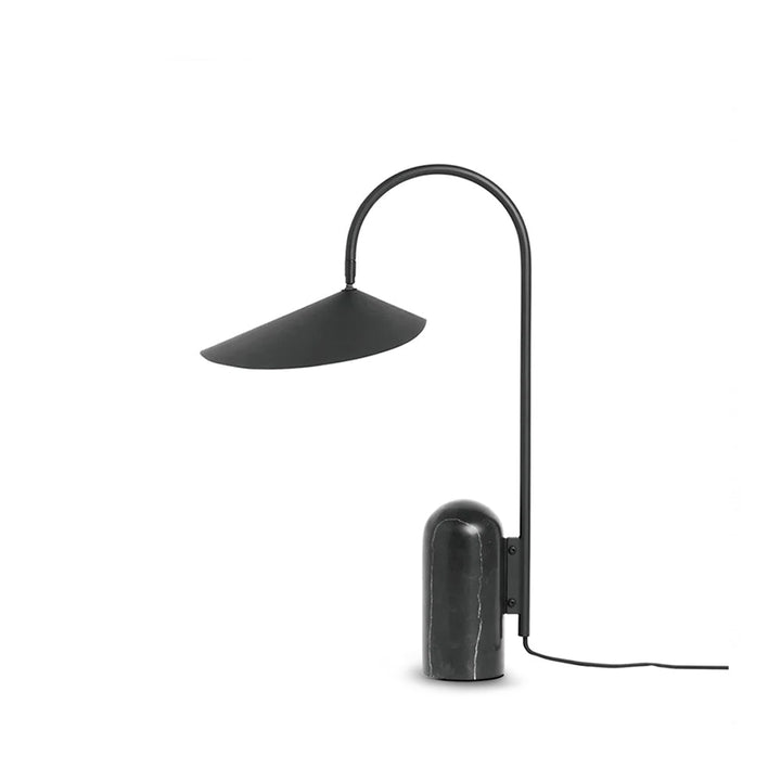 Modern sculptural table lamp, black, with arched design & marble base for living rooms.