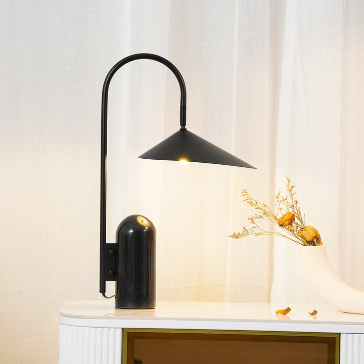 Modern accent table lamp, beige, sculptural arch & quality marble base for home decor.