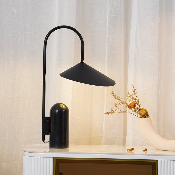 Black contemporary lamp, arched design, marble base, perfect for minimalist desks.