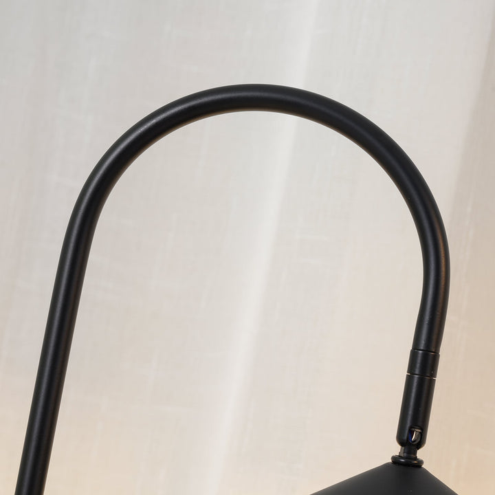 Arched table lamp, black, contemporary style with a sleek design & marble base.