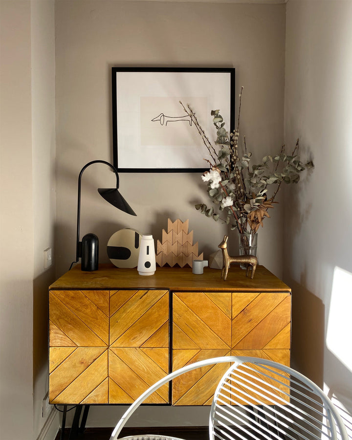 Modern bedside lamp, beige, sculptural arch, and a solid marble base for reading.