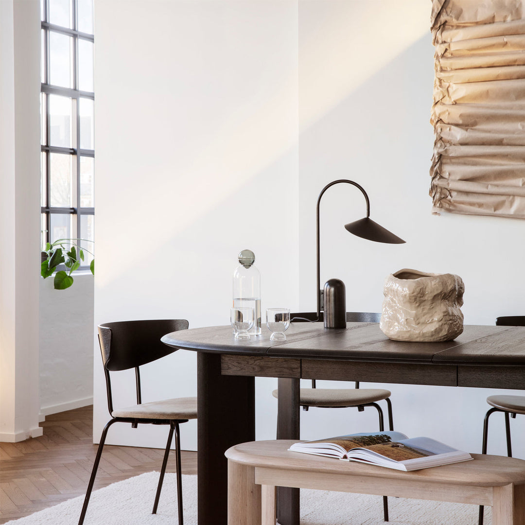 Modern black table lamp, arched, with a sophisticated marble base for desks & offices.