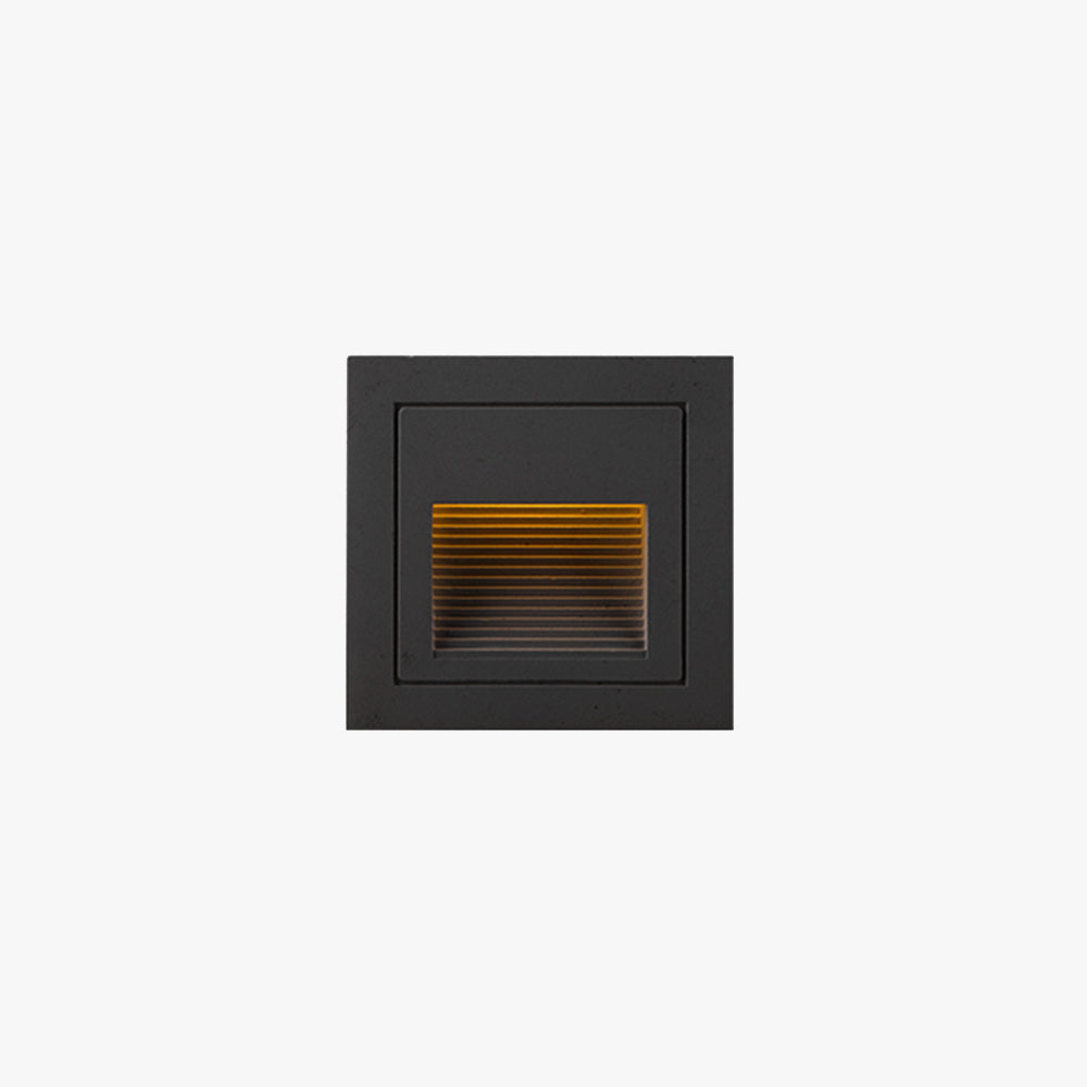 Modern square LED outdoor step light for deck & path illumination.