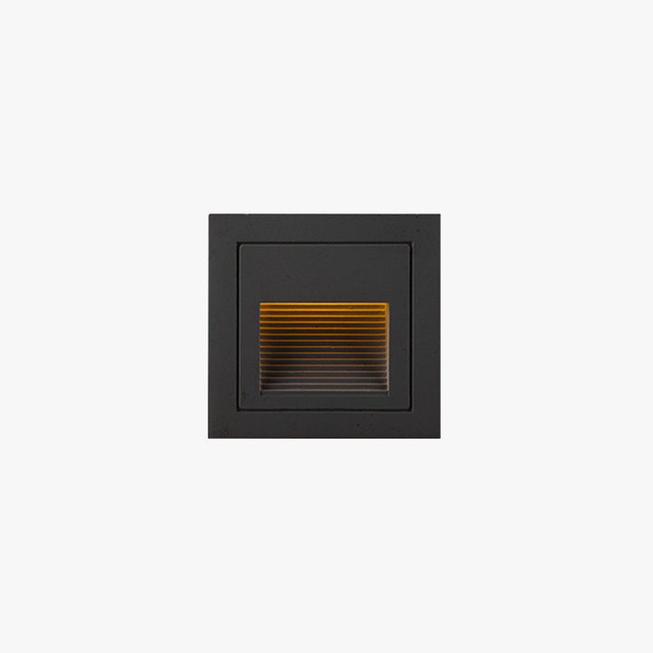 Modern square LED outdoor step light for deck & path illumination.