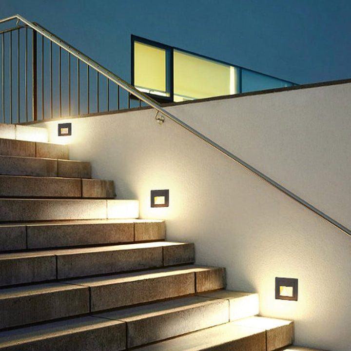 Bright LED square step light, ideal for modern deck, path & garden illumination.
