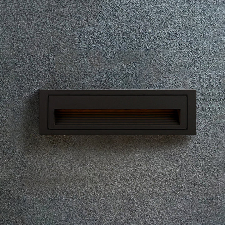 Sleek square LED step light for outdoor decks, enhancing path & garden safety.