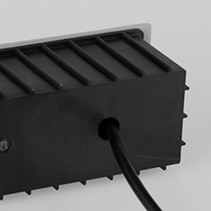 Outdoor square step light with motion sensor, enhancing modern deck & path safety.
