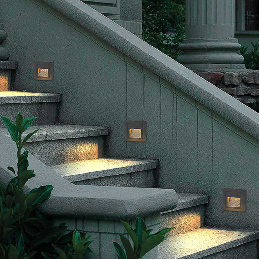 Stylish outdoor step light, square LED design for deck & courtyard lighting.