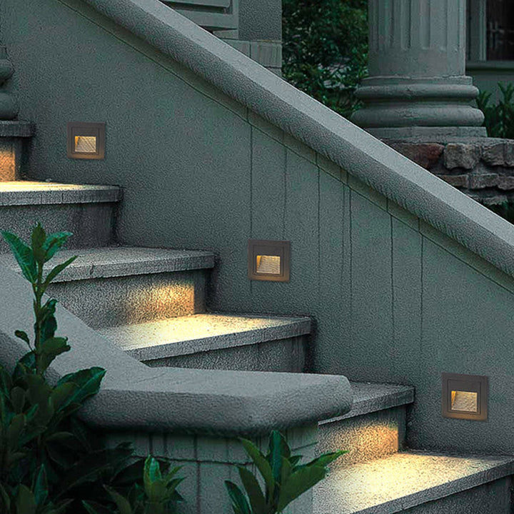 Stylish outdoor step light, square LED design for deck & courtyard lighting.