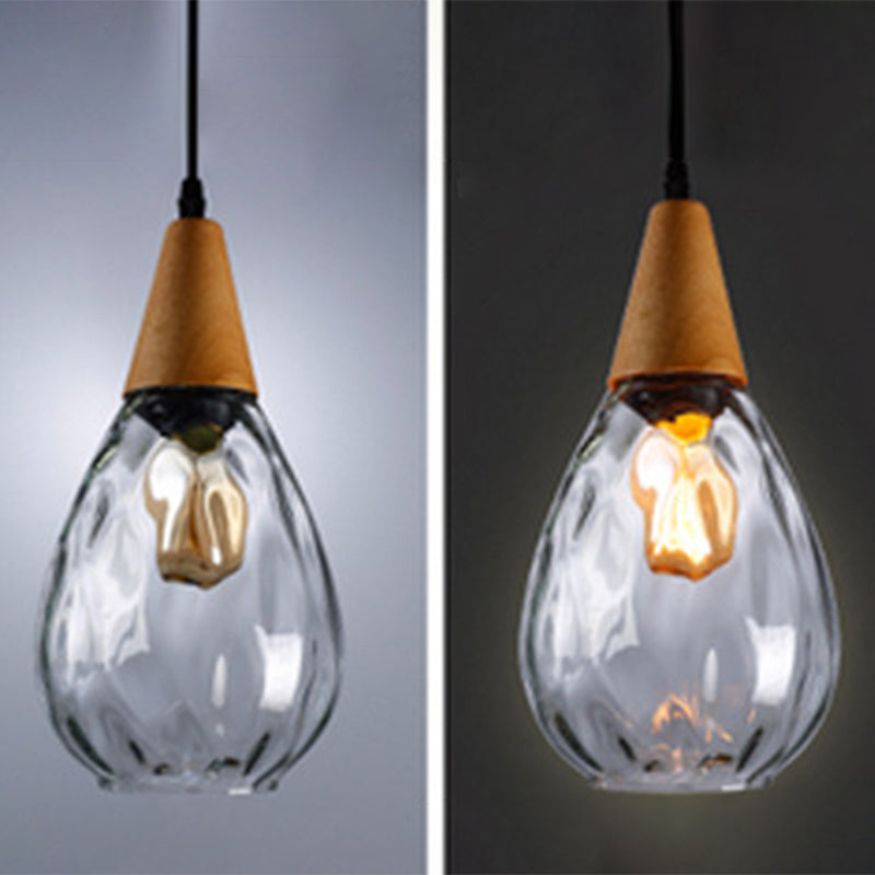 Unique teardrop glass pendant light, a decorative hanging fixture for modern homes.