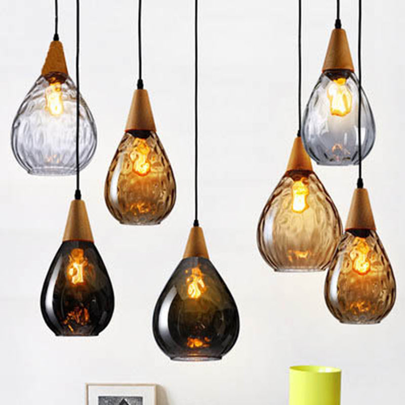 Home teardrop glass pendant, a sophisticated modern ceiling lamp for refined interiors.