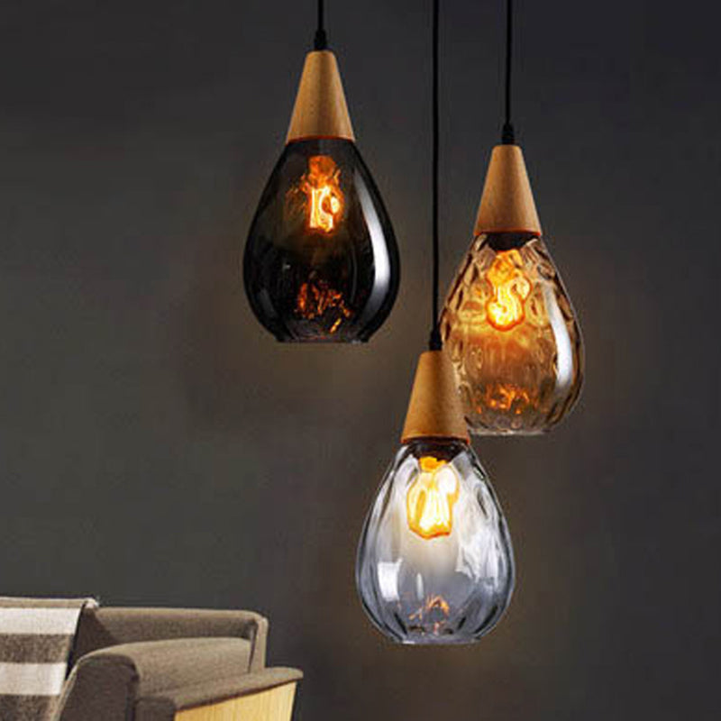 Beautiful glass teardrop pendant lamp, modern hanging light for stylish home interiors.