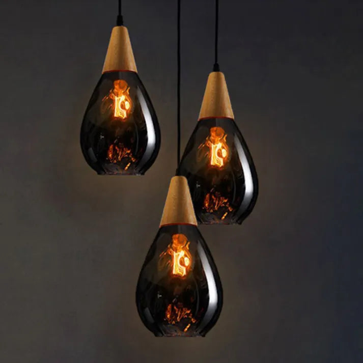 Contemporary teardrop glass pendant light, stunning hanging fixture for living spaces.