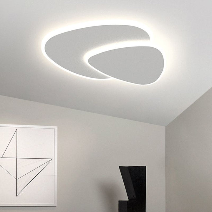 Sleek modern triangular LED flush mount ceiling light, perfect for contemporary interiors.