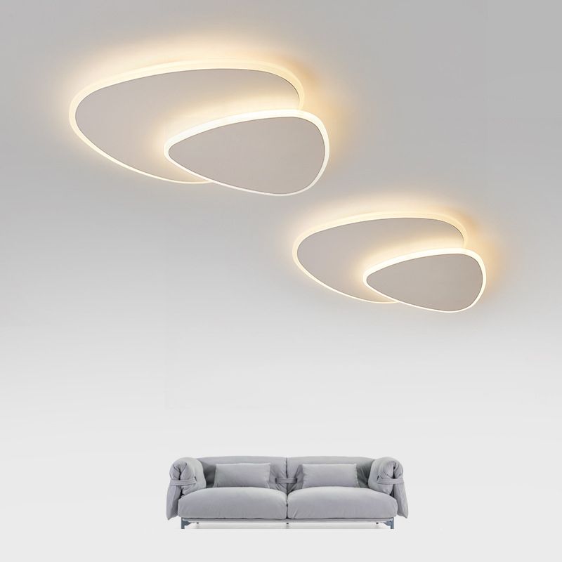 Modern geometric LED flush mount light, a triangular ceiling fixture for indoor elegance.