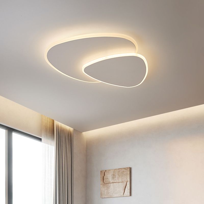 Sleek LED triangle flush mount ceiling light, offering minimalist ambient illumination.
