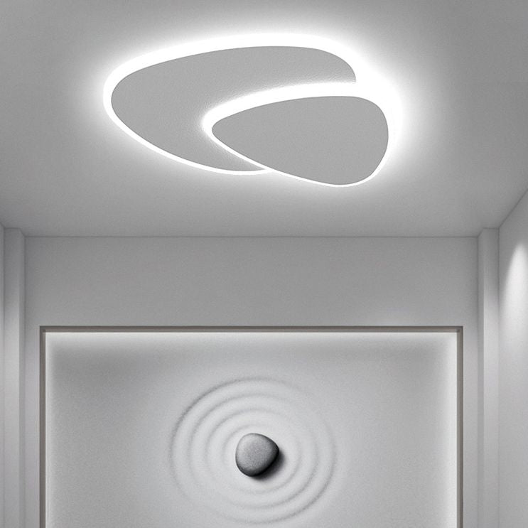 Minimalist triangle LED flush mount light, sleek ceiling fixture for modern homes.