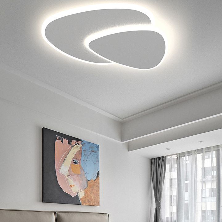Energy-efficient LED triangular flush mount ceiling light, provides soft ambient glow.