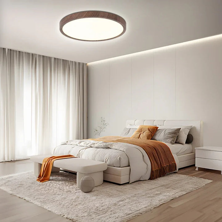 Stylish circular ceiling lamp featuring a warm walnut wood finish and bright LED illumination.