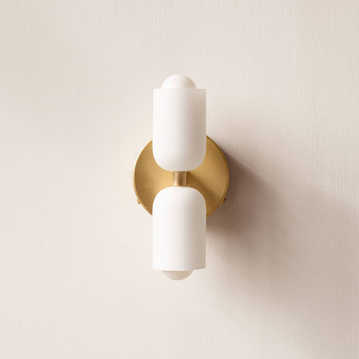 Modern uplight downlight wall lamp, creating subtle ambient interior lighting.