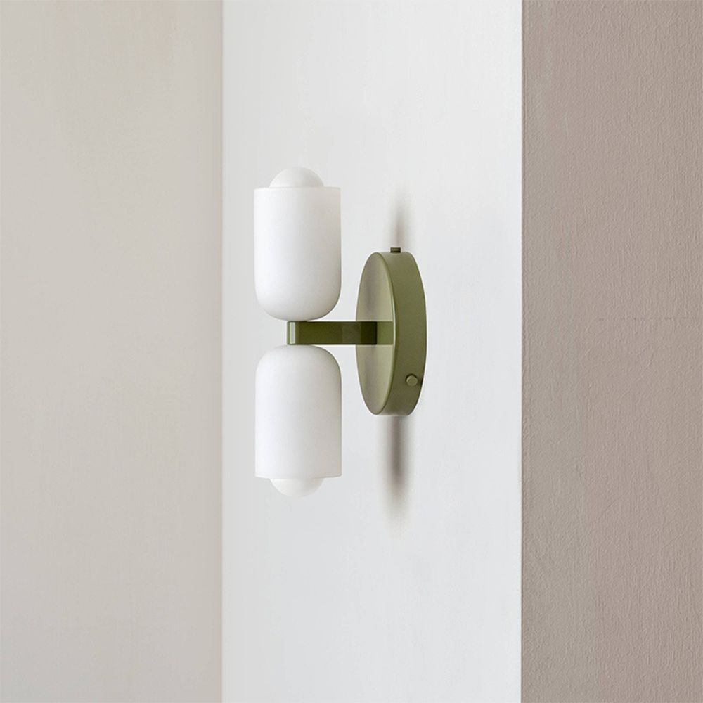 Elegant modern wall light with uplight and downlight, enhancing interior home decor.