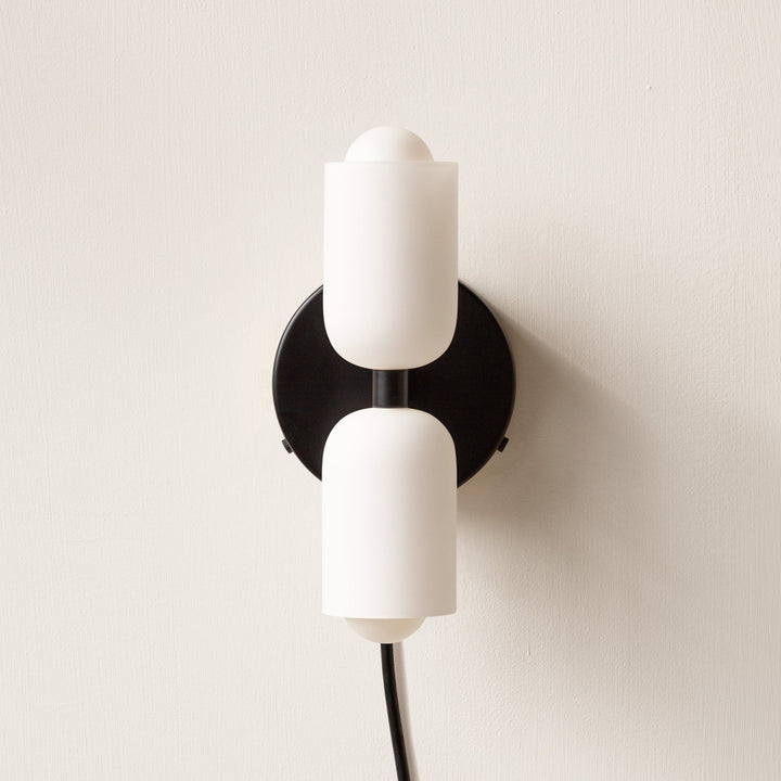 Accent uplight downlight wall light, adding contemporary ambient lighting to any room.