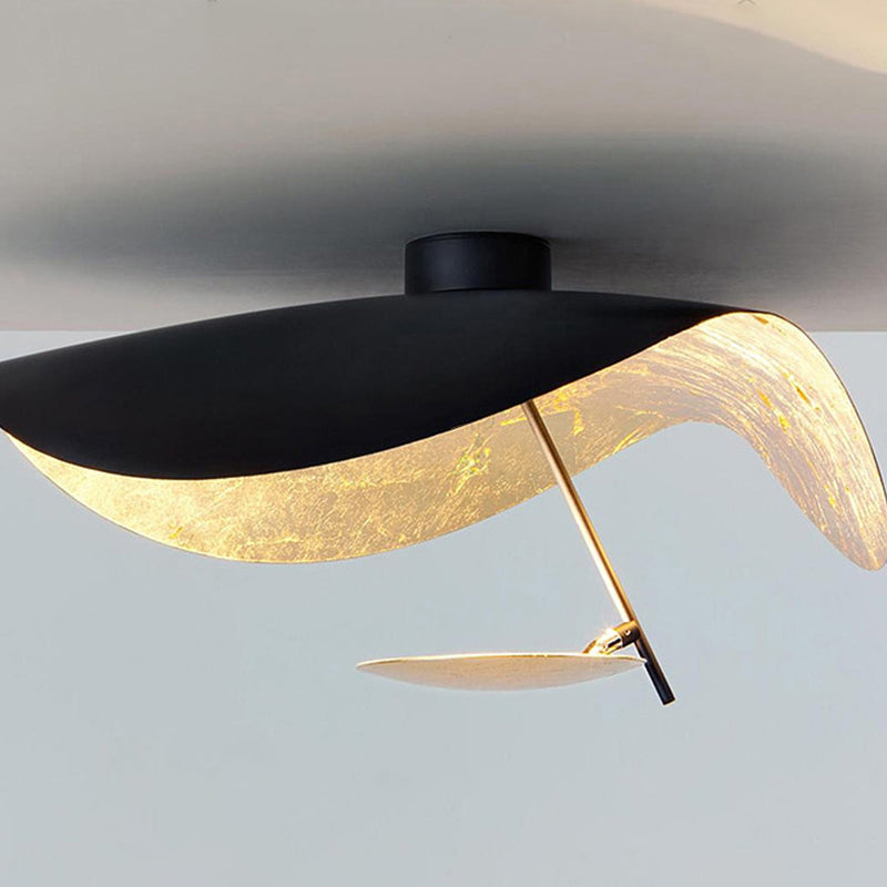 Sculptural Vellburn black leaf pendant light, elegant modern ceiling fixture for bedrooms.