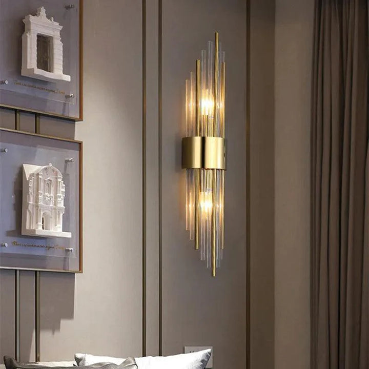 Gold Veloria crystal wall light, designer LED fixture adding modern elegance to any interior.