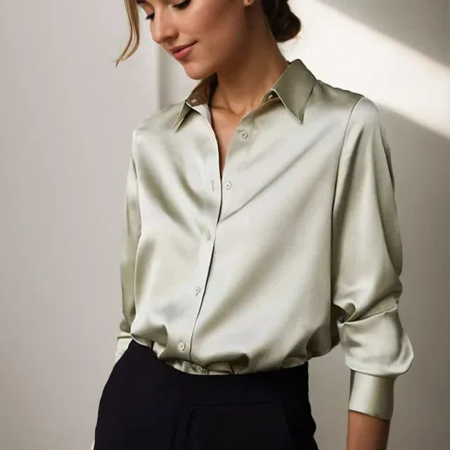 Modern women's button down blouse, perfect for versatile workwear or chic casual outfits. Elegant long sleeve style.