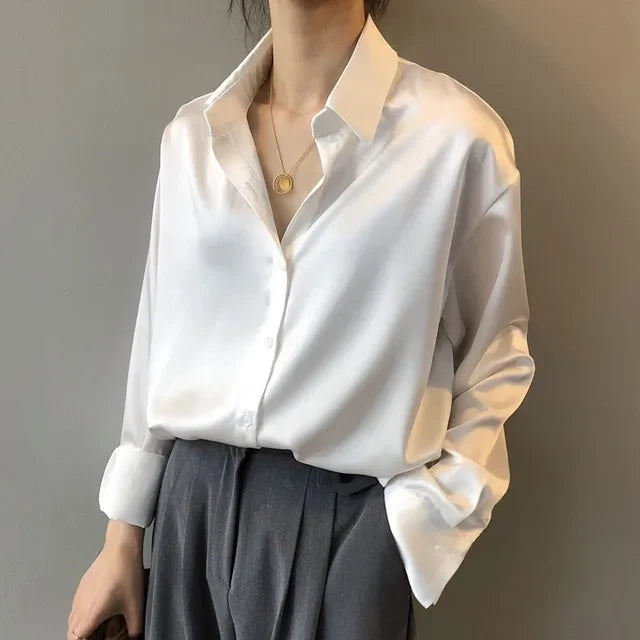 Chic women's button down blouse with long sleeves, ideal for modern office style or elegant casual wear.