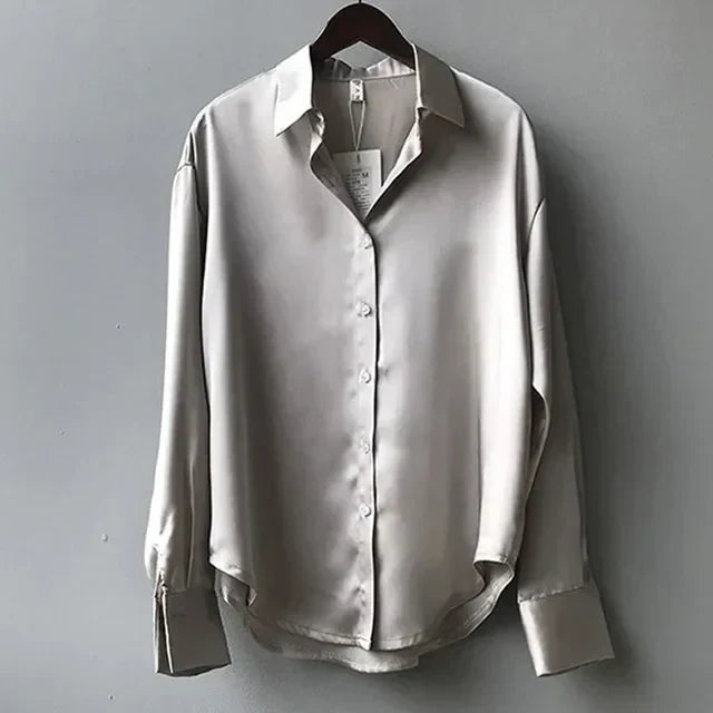 Elegant women's long sleeve button down blouse. A modern, versatile top for work or chic everyday style.