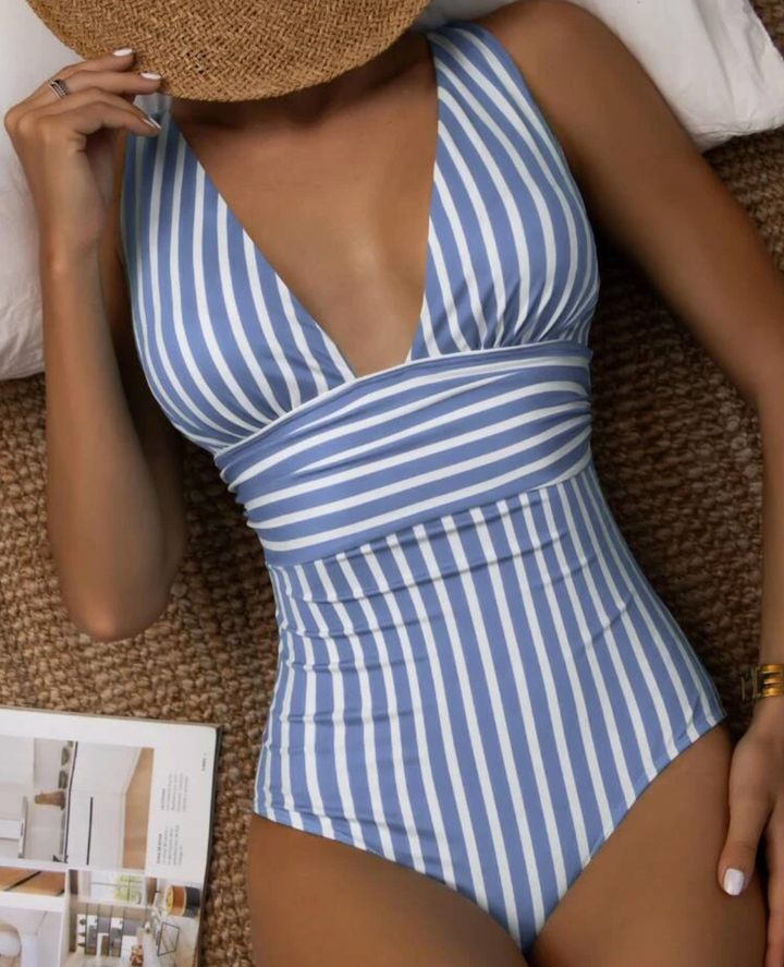 Chic women's one-piece swimsuit for summer fashion. Comfortable, stylish, perfect for beach or poolside.