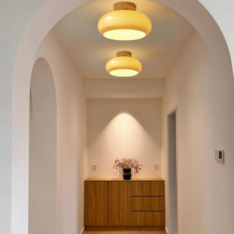 Versatile wooden flush mount ceiling light with a modern design, ideal for various indoor home lighting needs.
