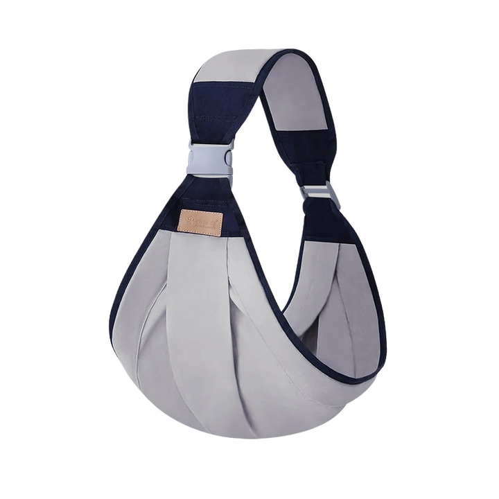 Hands-free babywearing with a versatile cotton sling wrap, perfect for parents on the go.