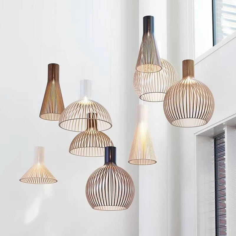 Cozy lighting from the Natura Orb wood lamp in a dining room setting.