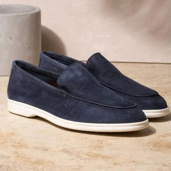 Men's round toe slip-on loafers in navy blue, ideal for smart casual style and comfort.