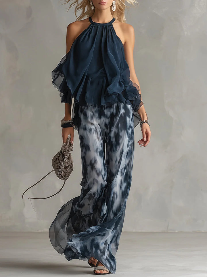 Navy blue tie-dye halter neck two-piece set for women, featuring wide leg pants & elegant summer style.