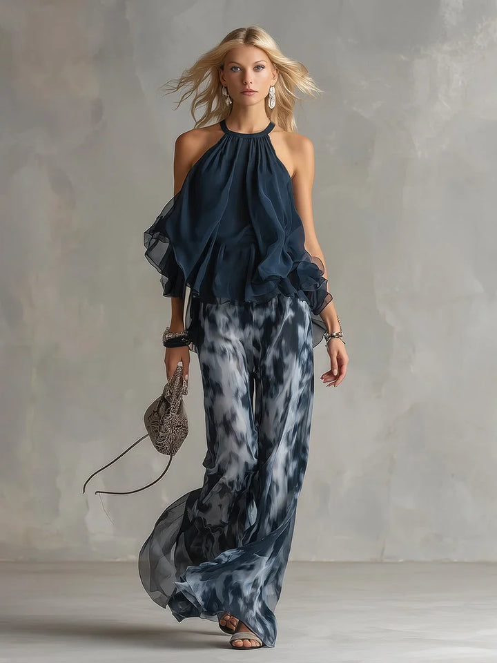 Woman wearing a chic navy tie-dye halter top and wide leg pants set, perfect for a casual summer outfit.