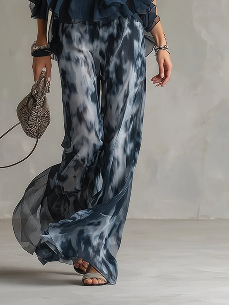 Women's navy tie-dye halter neck two-piece set with flowy wide leg pants, ideal for summer outfits.