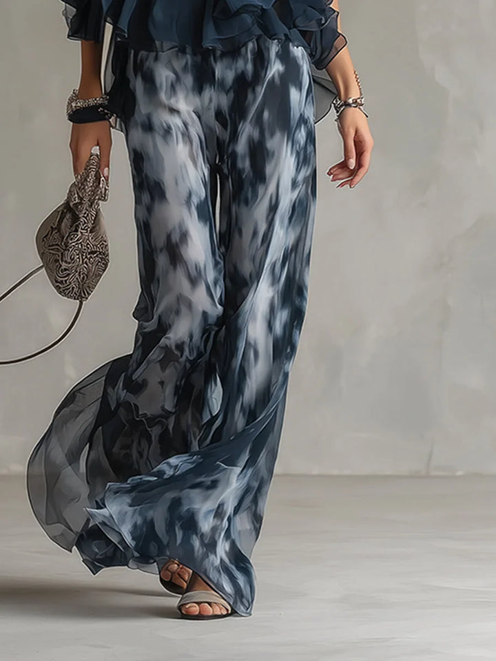 Women's navy tie-dye halter neck two-piece set with flowy wide leg pants, ideal for summer outfits.